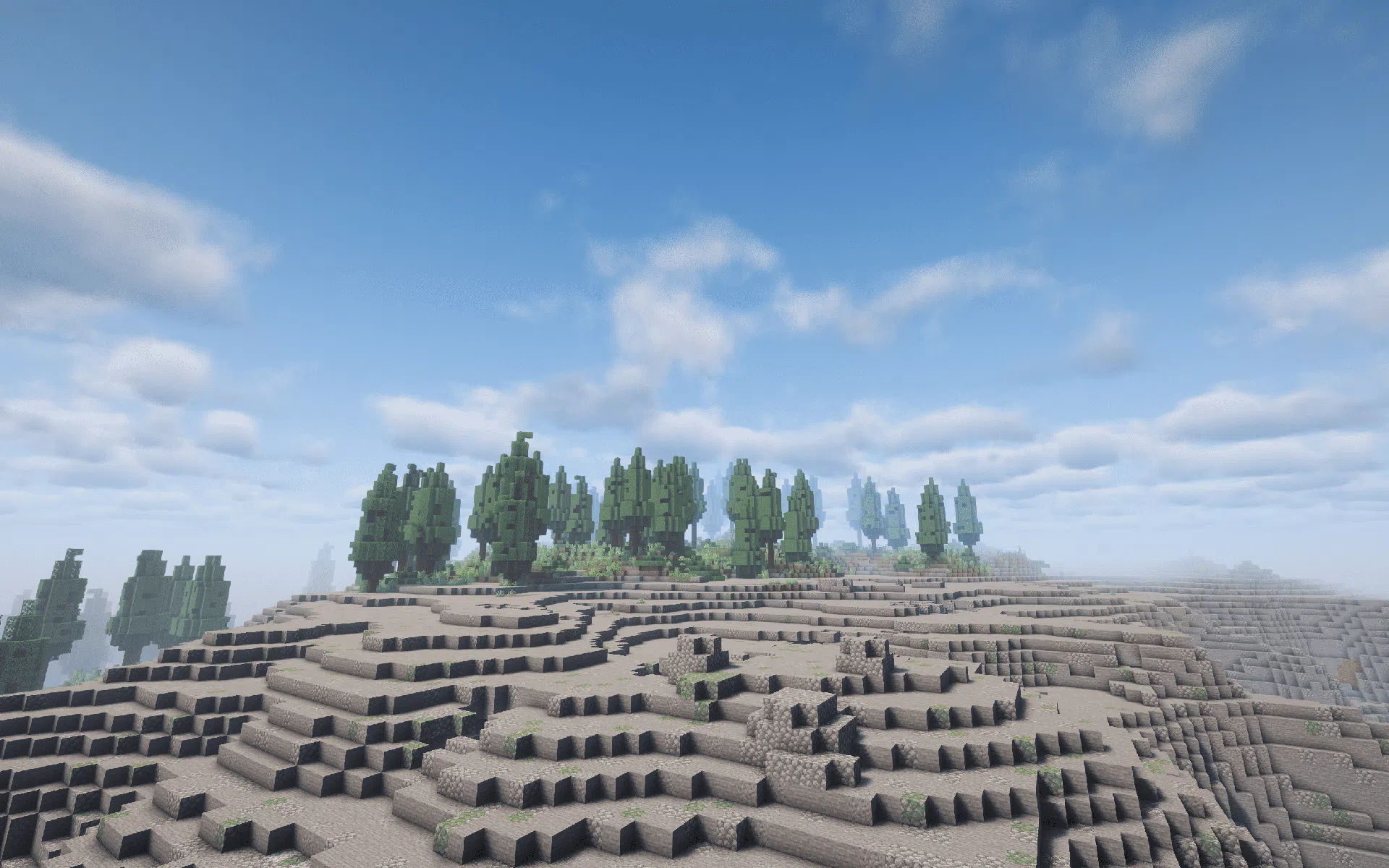 A stony shore with Taiga stretching beyond